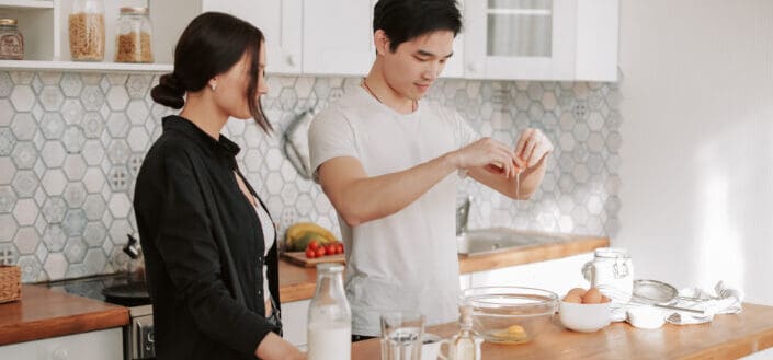 A couple preparing food in the kitchen