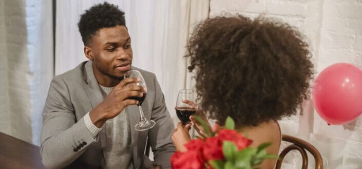 Couple having date while drinking wine
