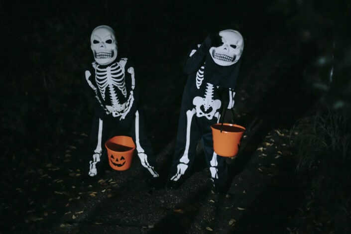 Children in halloween costumes in forest
