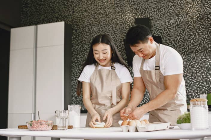 Couple having fun while preparing food together