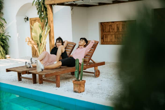 Couple on deckchair near pool