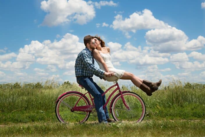 couple riding a bike together