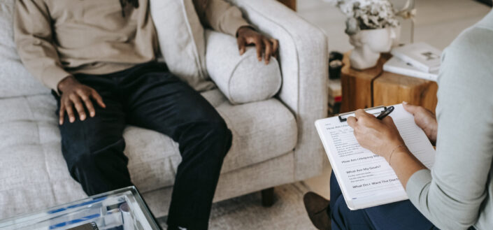 A Man sharing complains with female psychologist