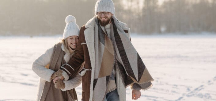 Cute couple on a snow covered ground