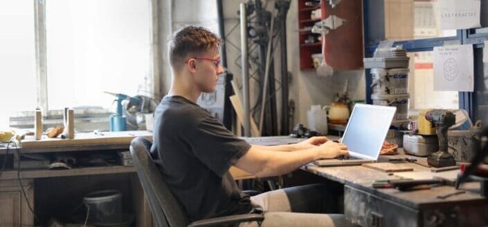 Focused man working on laptop