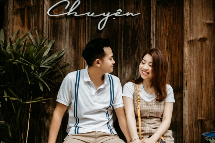 Asian couple sitting on stairs