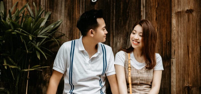 Happy couple sitting on stairs