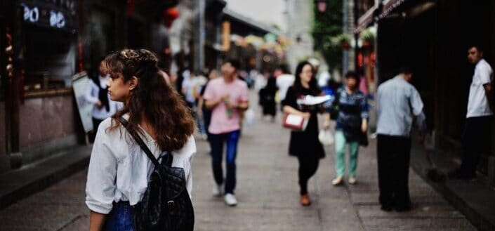 woman walking in a crowded street