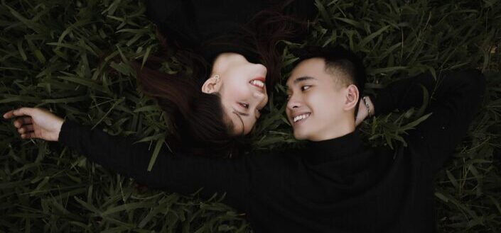 Couple lying on the grass