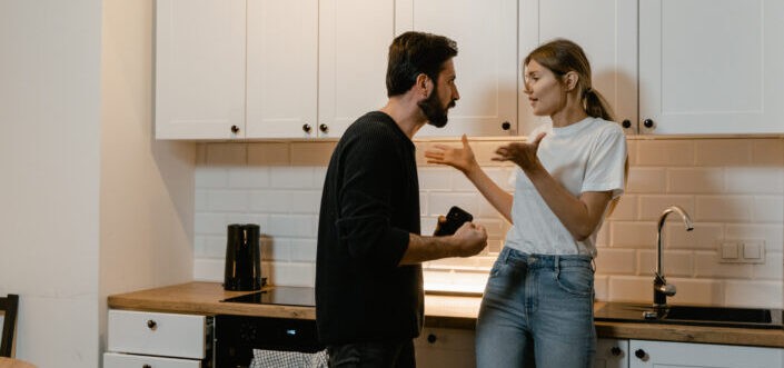 Man and woman arguing in the kitchen