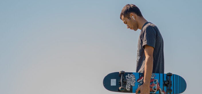 Man holding a skateboard