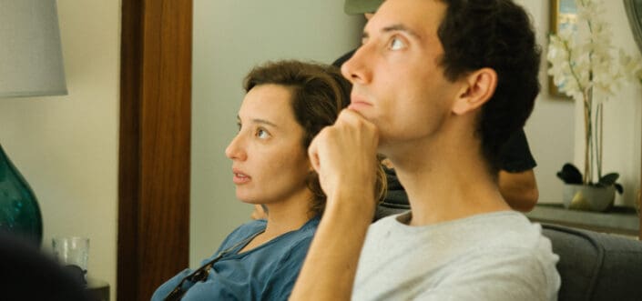 Man sitting beside woman