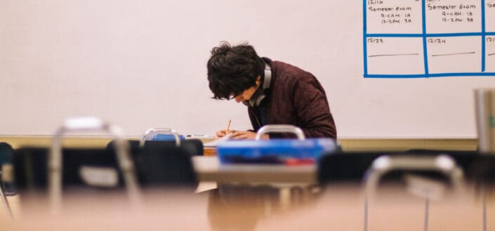 Man writing on table