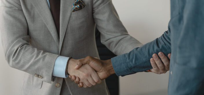 two people giving a handshake