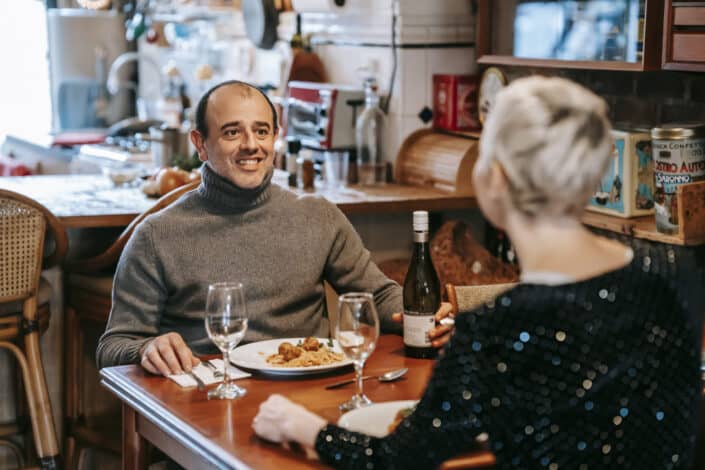 Couple having wine and pasta in a restaurant