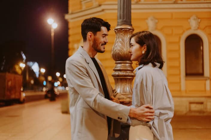 Couple Holding Each Other Under a Lamp Post