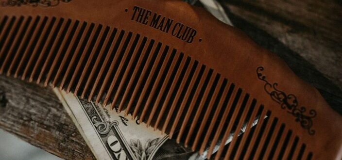 wooden comb above a dollar bill