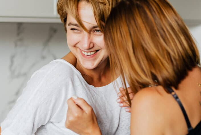 Women smiling together