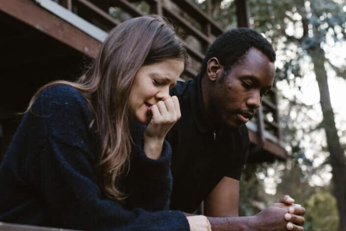 woman crying beside her boyfriend