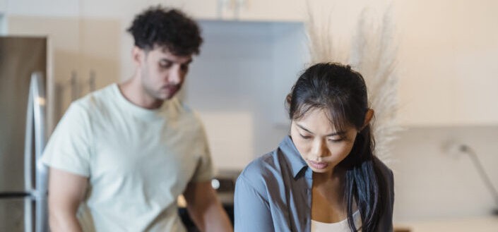 Young man and woman in the kitchen