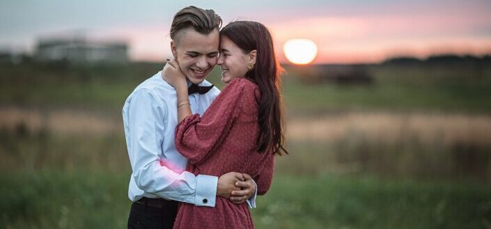 Couple Embracing During Romantic Date at Sunset