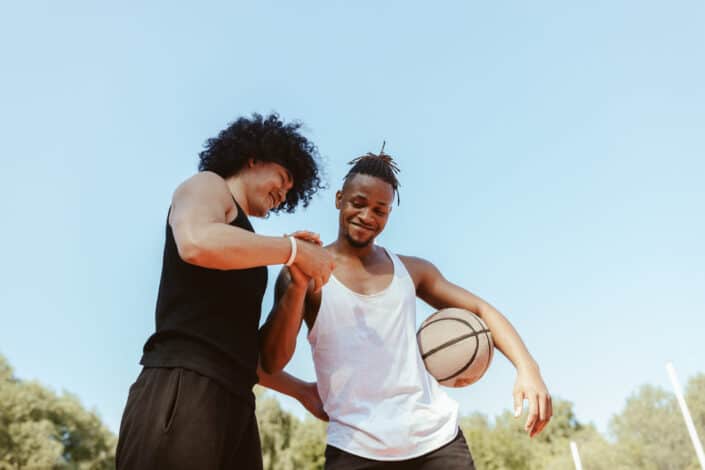 two men playing basketball