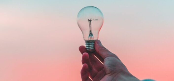 person holding a light bulb