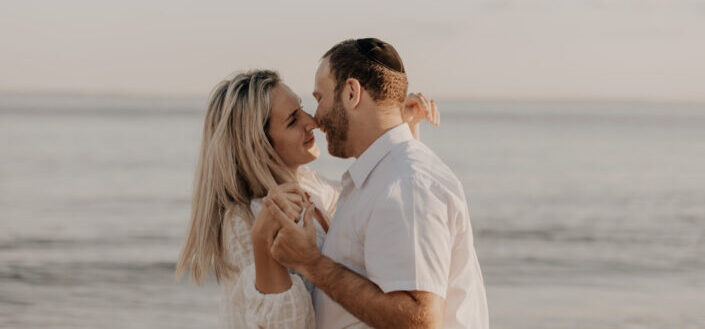 Couple Kissing by the Ocean