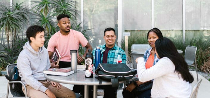 Group of People Sitting at the Table