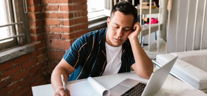 College Kid Falling Asleep While Studying