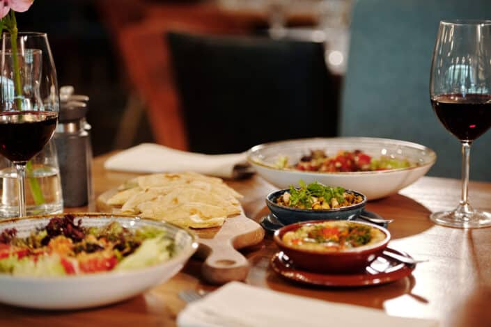 Assortment of Food on the Table Near the Wine Glasses