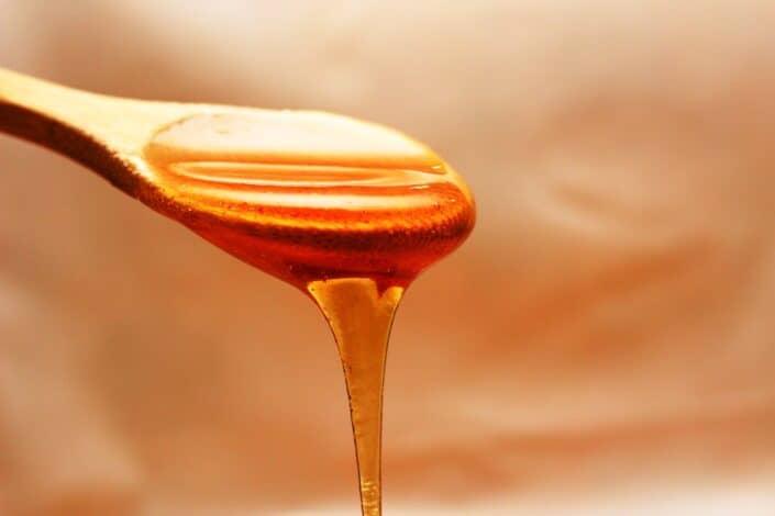 Honey Dripping From a Spoon