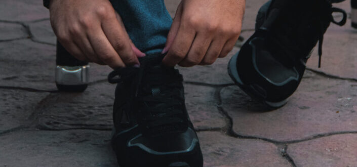 Person Tying Shoelaces