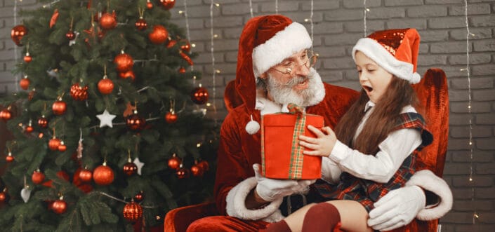 Girl receiving gift from santa