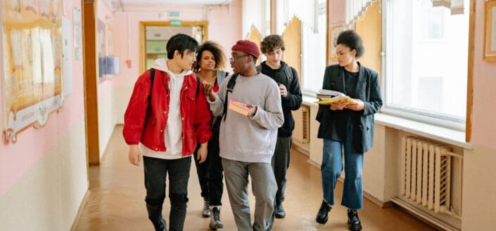 Group of People Walking on a Hallway