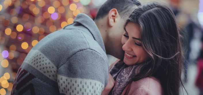 Person Hugging a Woman Outdoors