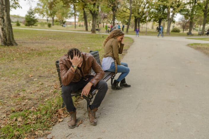 Man and woman sitting on bench