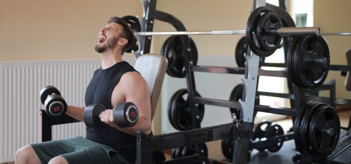 Man Working Out on Exercise Equipment