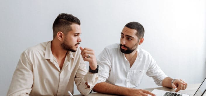 Men Sitting By the Table With Laptop