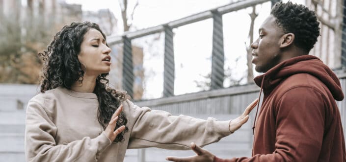 Multiracial couple having conflict on street