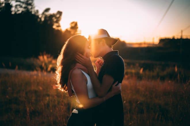 Man and Woman Kissing During Sunset - Signs the Kiss Meant Something to Him