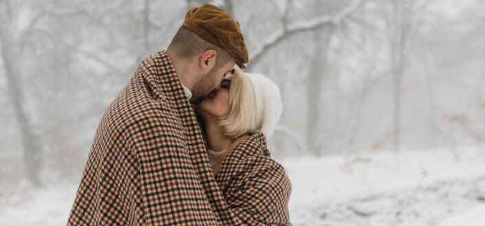 Sweet Moments in the Snow of Romantic Couple