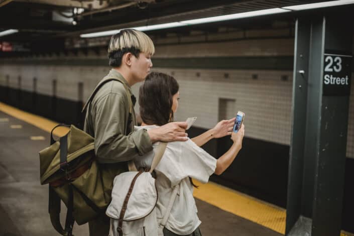 Young Couple Taking Selfie on Metro Station