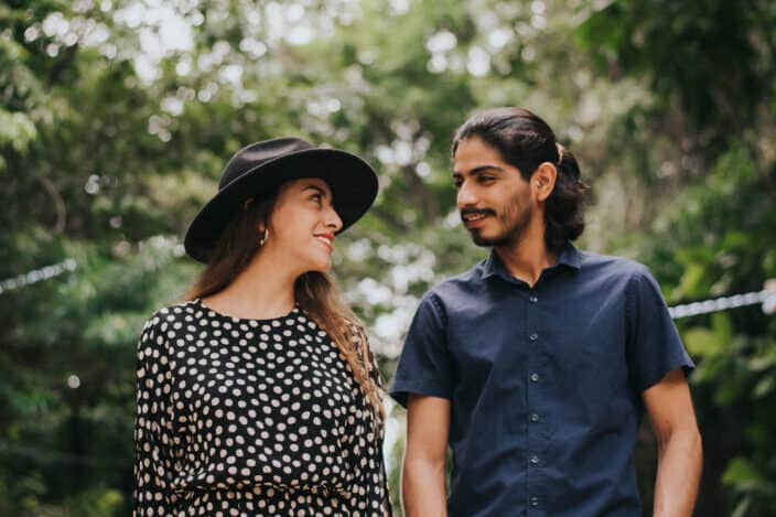 A couple holding hands in a park