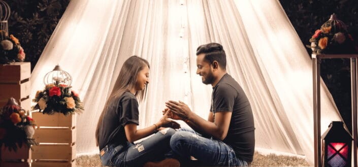 Couple in Black Shirt Sitting on The Grass