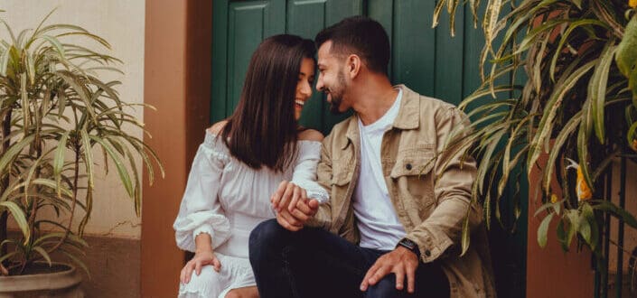 Couple Holding Hands Looking At Each Other