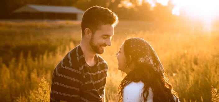 couple smiling during sunrise