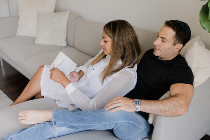 A couple reading a book 