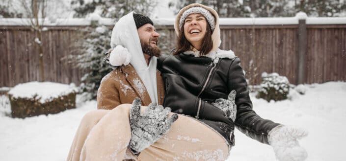 couple playing in the snow