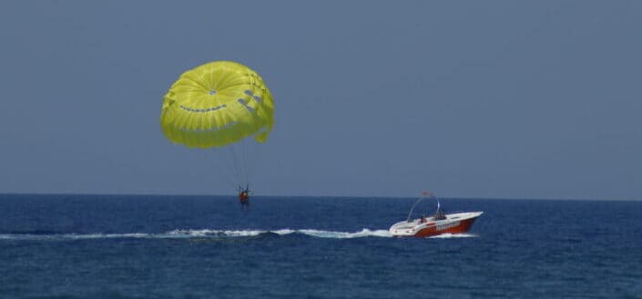 Person Parasailing in the Ocean